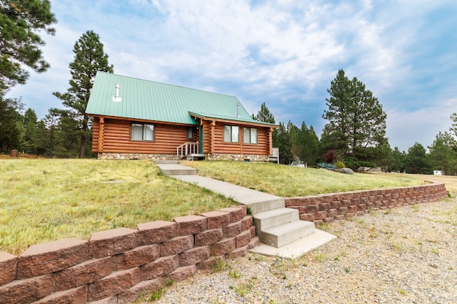 log home with a front lawn