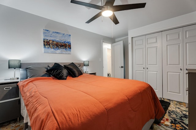 bedroom with ceiling fan and a closet