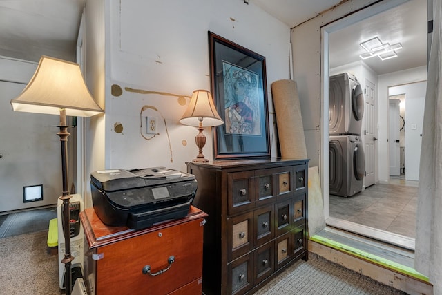 interior space with stacked washing maching and dryer