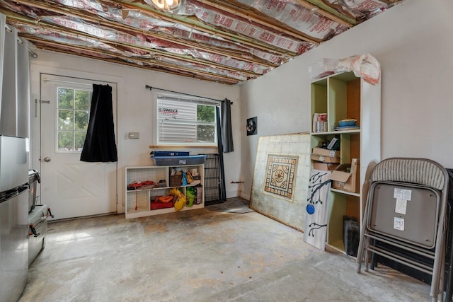 basement featuring stainless steel fridge