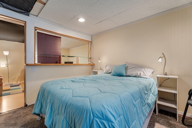 carpeted bedroom with ornamental molding