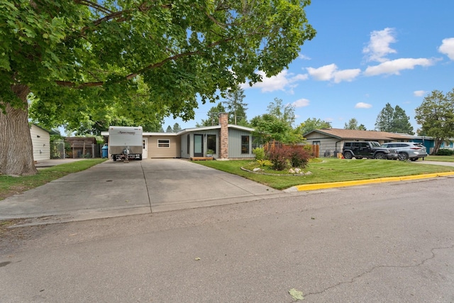 ranch-style home featuring a front yard