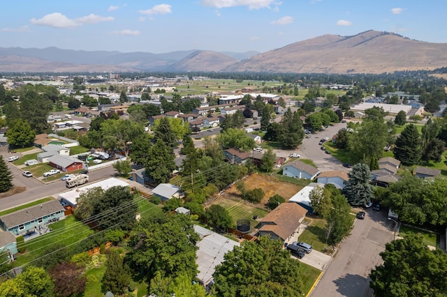 birds eye view of property featuring a mountain view