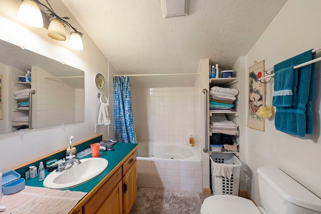 full bathroom with a textured ceiling, toilet, shower / tub combo, and vanity