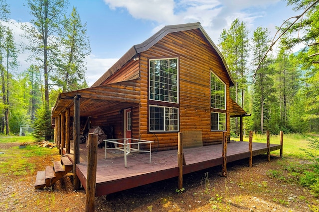 view of side of home featuring a deck