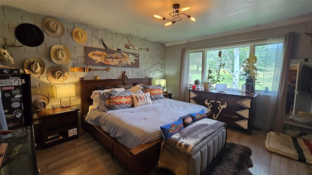 202 Lakeshore Dr, Kalispell, MT 59901 - bedroom with ornamental molding and hardwood / wood-style floors