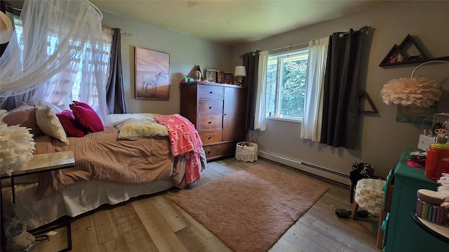 202 Lakeshore Dr, Kalispell, MT 59901 - bedroom featuring a baseboard radiator and wood finished floors