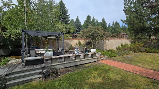 202 Lakeshore Dr, Kalispell, MT 59901 - view of yard with a fenced backyard, a wooden deck, and a pergola