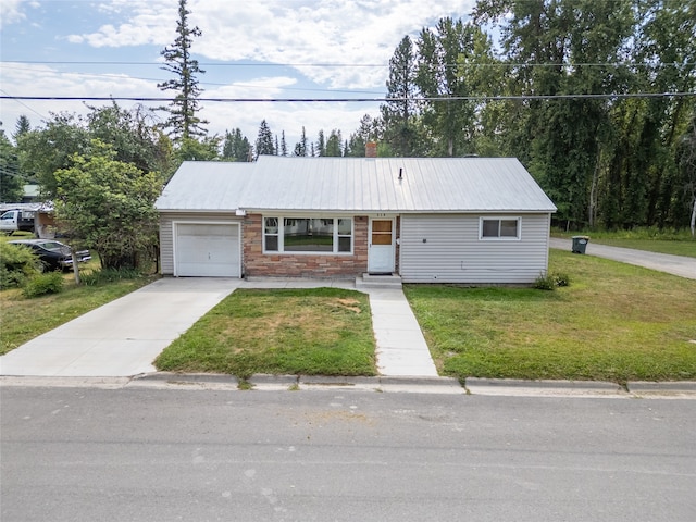 single story home featuring a garage and a front yard