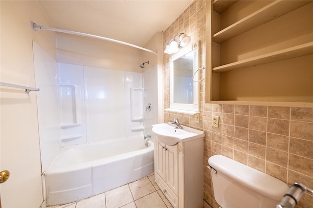 full bathroom featuring tile walls, toilet, vanity, tile patterned flooring, and shower / bath combination