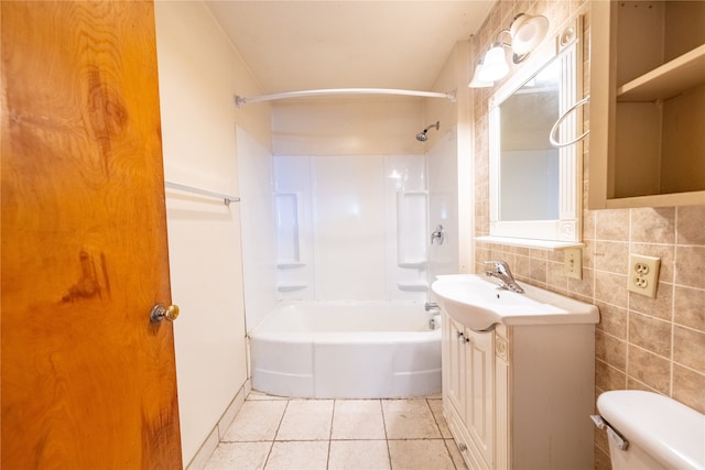 full bathroom with toilet, tile walls, shower / bathtub combination, tile patterned flooring, and vanity