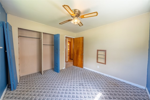 unfurnished bedroom featuring ceiling fan, carpet flooring, and a closet