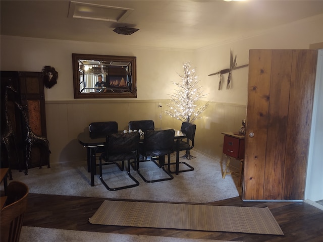 dining space with hardwood / wood-style flooring