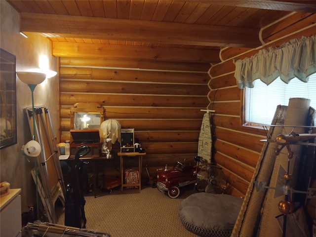 interior space with wood ceiling, beam ceiling, and rustic walls