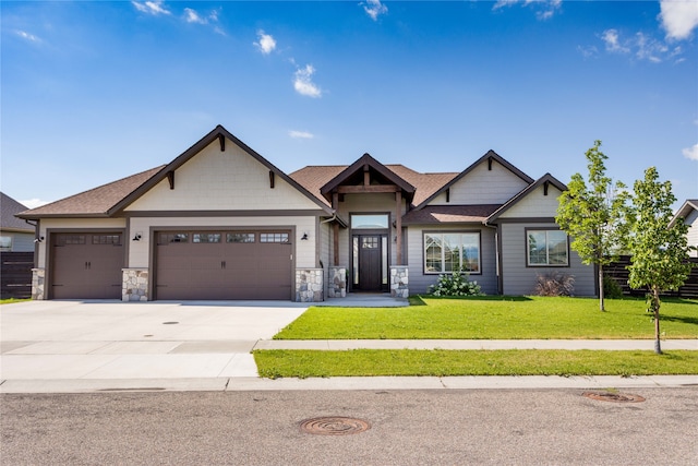 craftsman-style home with a front lawn and a garage