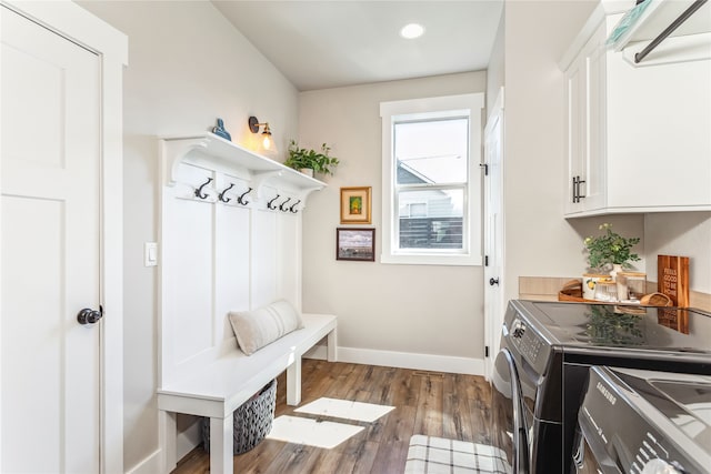 mudroom featuring hardwood / wood-style floors and independent washer and dryer