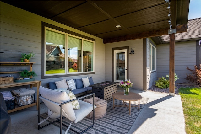 view of patio / terrace with an outdoor living space with a fire pit