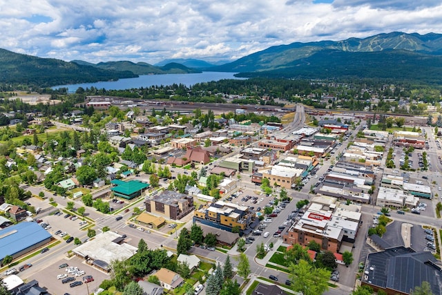 bird's eye view with a water and mountain view