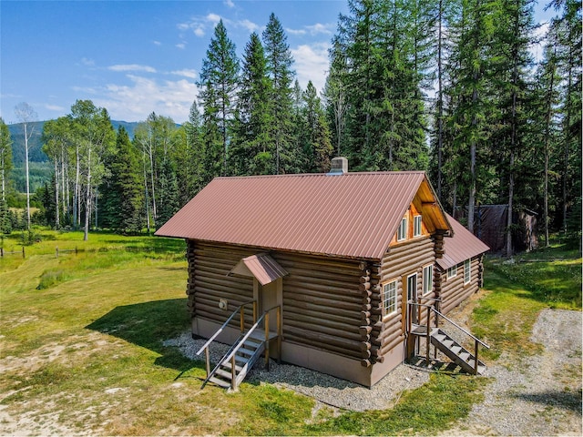 view of outbuilding featuring a wooded view