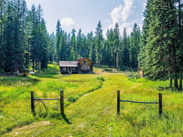 view of yard with a view of trees