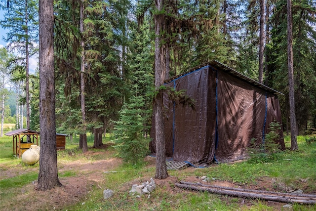 view of yard with a forest view