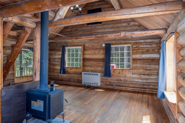 basement featuring wood walls, carpet flooring, wood ceiling, visible vents, and stairway