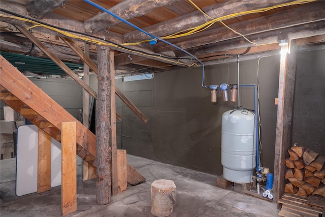 unfinished basement featuring electric panel