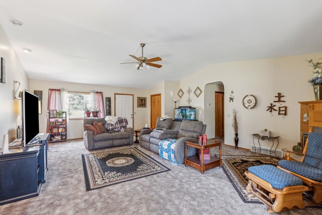 carpeted living room with ceiling fan