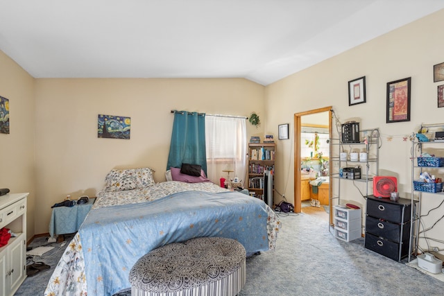 carpeted bedroom with vaulted ceiling