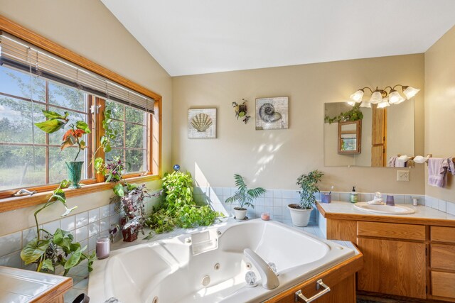 bathroom featuring lofted ceiling and vanity