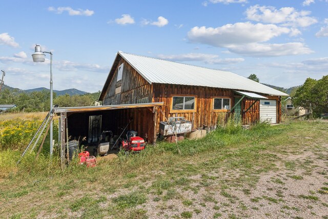 view of outbuilding with a mountain view