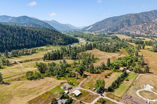 drone / aerial view featuring a mountain view and a rural view