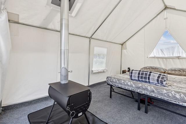 carpeted bedroom featuring vaulted ceiling