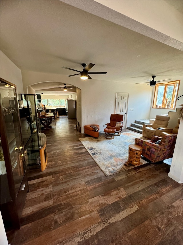 living room with ceiling fan and hardwood / wood-style flooring