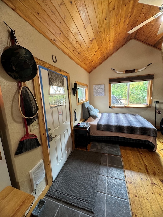 bedroom featuring hardwood / wood-style floors, wooden ceiling, and vaulted ceiling