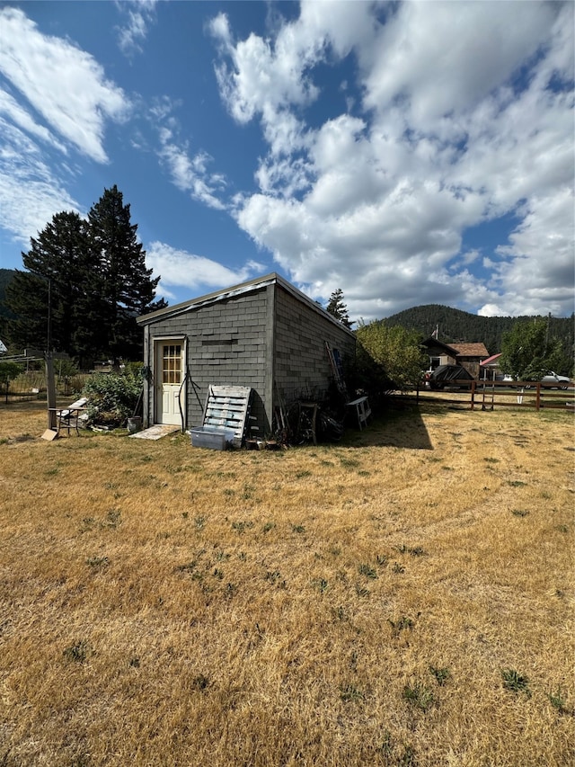 view of outdoor structure with a lawn