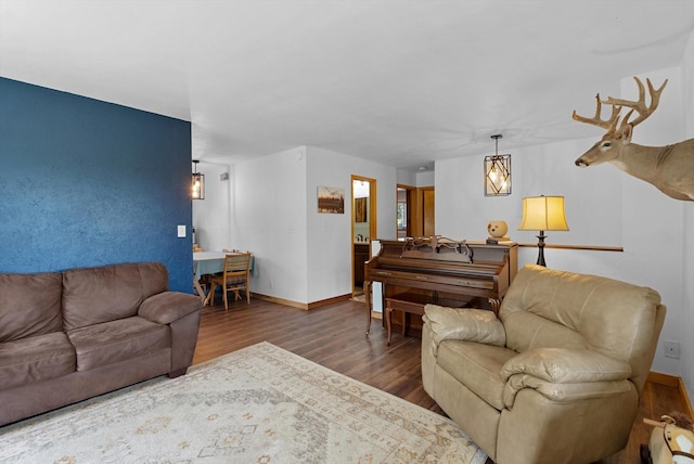 living area with wood finished floors and baseboards