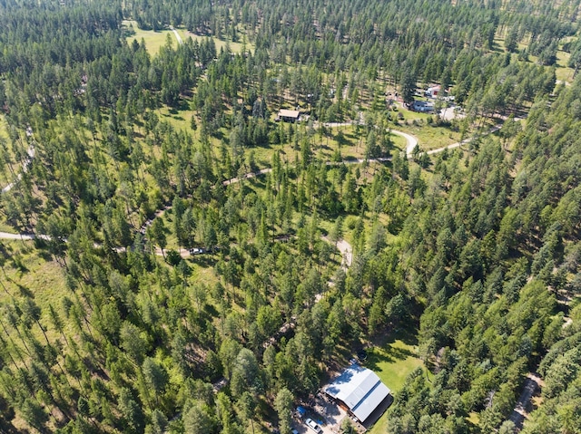 aerial view featuring a view of trees