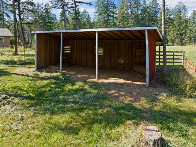 view of outbuilding featuring an outdoor structure and a detached carport