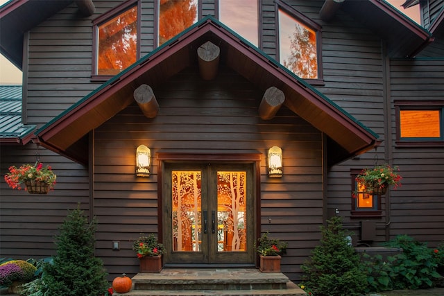 doorway to property with french doors and metal roof