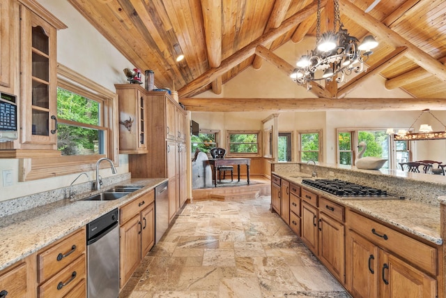 kitchen with glass insert cabinets, stone tile floors, wooden ceiling, an inviting chandelier, and a sink