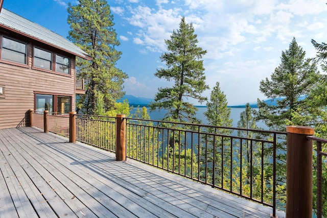 wooden deck with a water view