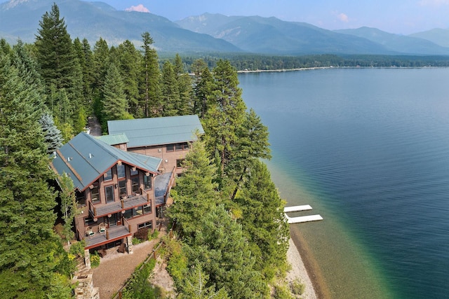 drone / aerial view with a water and mountain view