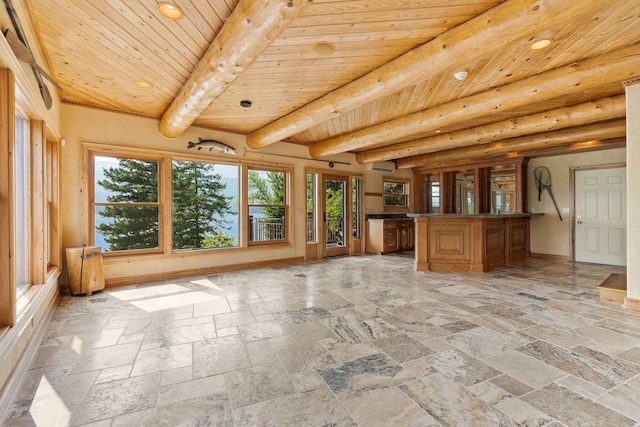 unfurnished sunroom with a wall mounted air conditioner, beamed ceiling, and wood ceiling