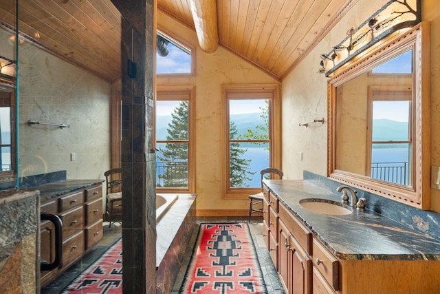 bathroom featuring a garden tub, wood ceiling, vanity, and lofted ceiling