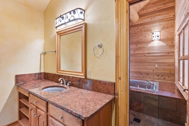 bathroom featuring a tub and vanity