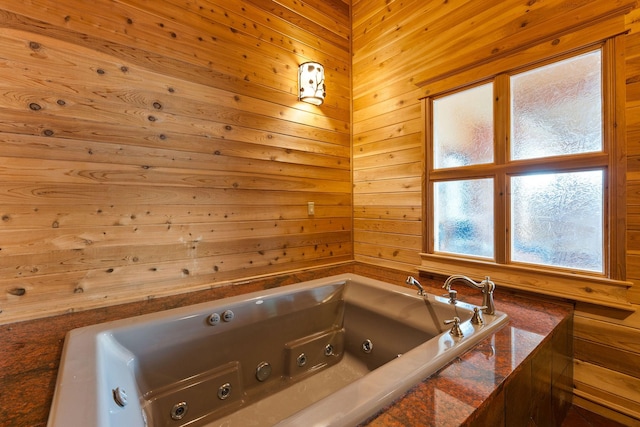 full bathroom featuring a tub with jets