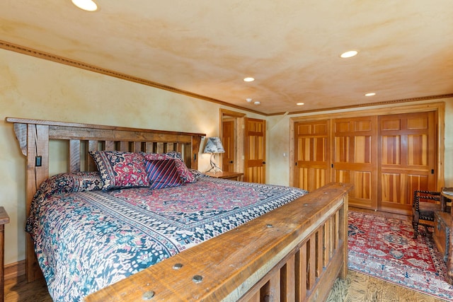 bedroom featuring recessed lighting, wood finished floors, and crown molding