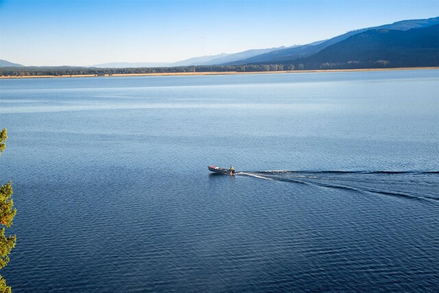 property view of water featuring a mountain view