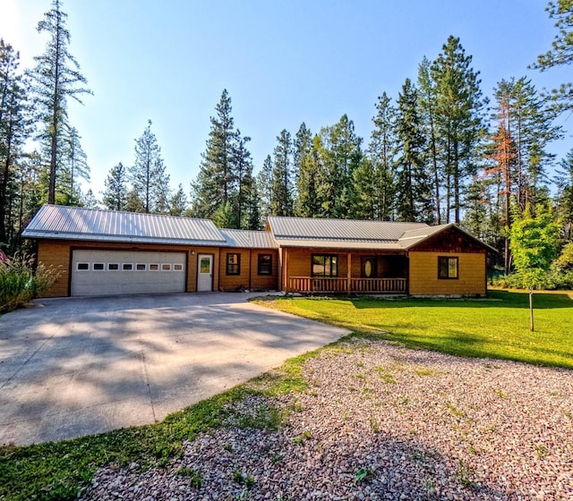 single story home featuring a garage and a front yard